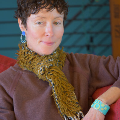 Ruth - Ford Thunderbird earrings worn by a model showcasing stainless steel wire and sterling silver posts design