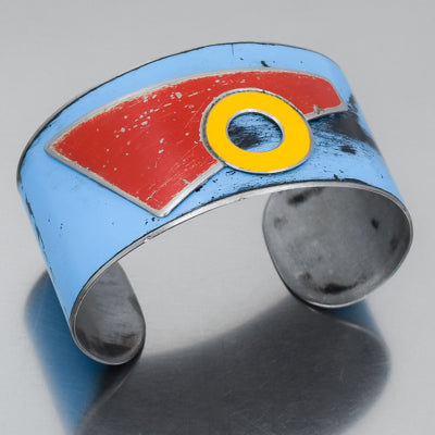 Woodrow - Chevy, Toyota, Ford bracelet with blue, red, and yellow distressed truck designs on adjustable metal band.