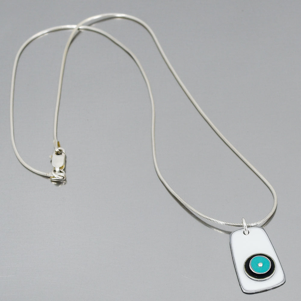 Sterling silver snake chain necklace with a rectangular pendant featuring original car paint from Audi, GMC, and Ford models.