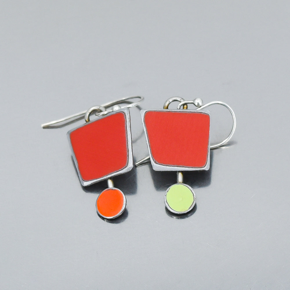 Sterling silver earrings with red and orange square and circle enamel shapes inspired by classic car paint colors.