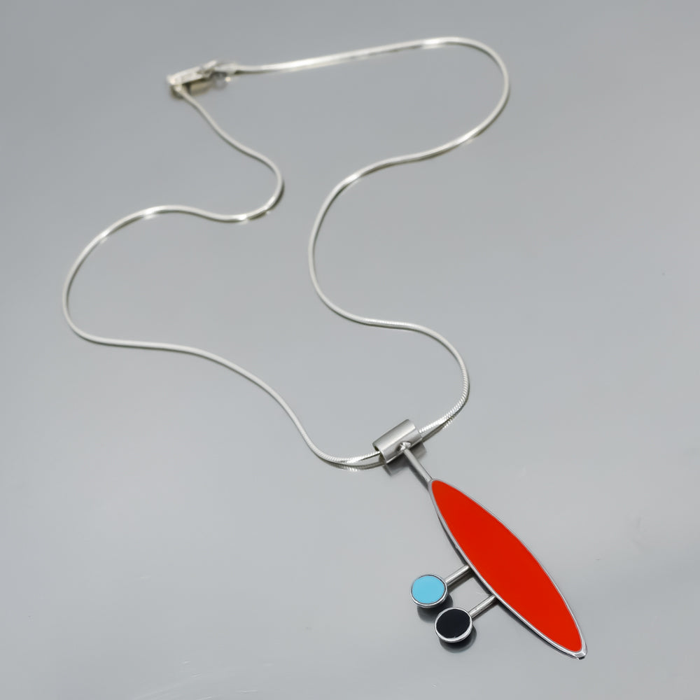 Sterling silver necklace with a pendant featuring red, turquoise, and black elements inspired by classic 60s vehicles.