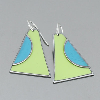 The Earnestine - Plymouth & Ford earrings feature trapezoid shapes with silver outlines, lime green bases, and blue curved accents, inspired by vintage car parts. Hook-style fasteners; photographed on a plain gray background.