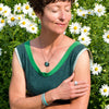 Sammy - Chevy pickup ring size 8 worn on woman’s hand with daisies in background outdoors.