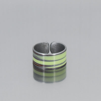 The Delmar - Plymouth Satellite, is a green band style adjustable ring made using vintage car parts with the original car paint intact.