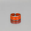 Samson ring, adjustable, orange with an etched strip made from a 74 Ford F150 pickup with the original car paint intact. 