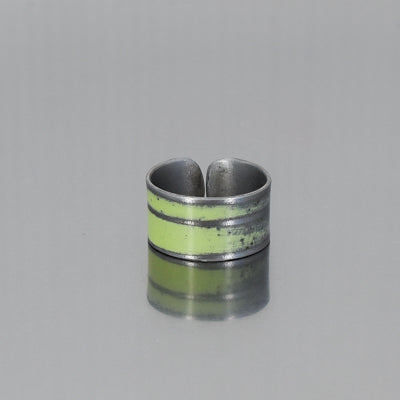 The Delmar - Plymouth Satellite is a green  adjustable ring with etched stripes, made from vintage car parts with original paint intact. Handmade by Joyride Jewelry.