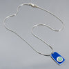 Marion - Ford & Dodge silver chain necklace with blue 75 Ford pickup pendant on gray background.
