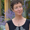 Model wearing Earnestine - Chevy & Ford pendant necklace with oxidized sterling silver chain outdoors.