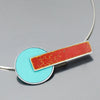 The Lana - Ford & Dodge is a modern pendant necklace with a turquoise blue circle and textured red rectangular bar, both set in sterling silver cable on a simple silver chain, shown against a gray background.