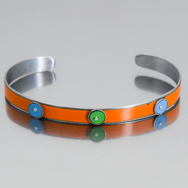 Emril -AMC, Chevy, Ford bracelet with orange, blue, and green original car paint inlaid on adjustable metal band.