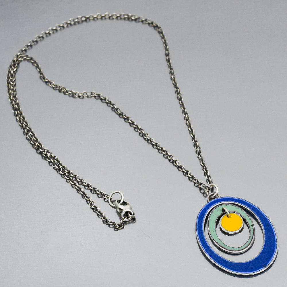 Earnestine - Ford & Dodge pendant necklace with oxidized sterling silver chain and colorful concentric circles design.