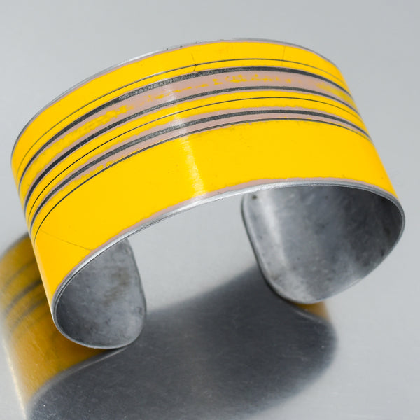 yellow cuff bracelet for men and women. handmade using vintage car parts with the original car paint intact. Joyride Jewelry. Jewelry made from vintage car parts. 
Fun, unique, original, colorful
sustainable, recycled 