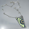 green and grey necklace handmade using vintage car parts with the original car paint intact. Joyride Jewelry. Jewelry made from vintage car parts. 
Fun, unique, original, colorful
sustainable, recycled 
mid century modern, retro vibe, 
Big, Bold, striking, statement, one of a kind necklace. oxidized sterling silver chain.