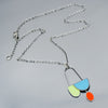 handmade green, turquoise and orange pendant or necklace using vintage car parts with the original car paint intact. Joyride Jewelry. Jewelry made from vintage car parts. 
Fun, unique, original, colorful
mid century modern, retro vibe
sustainable, recycled 