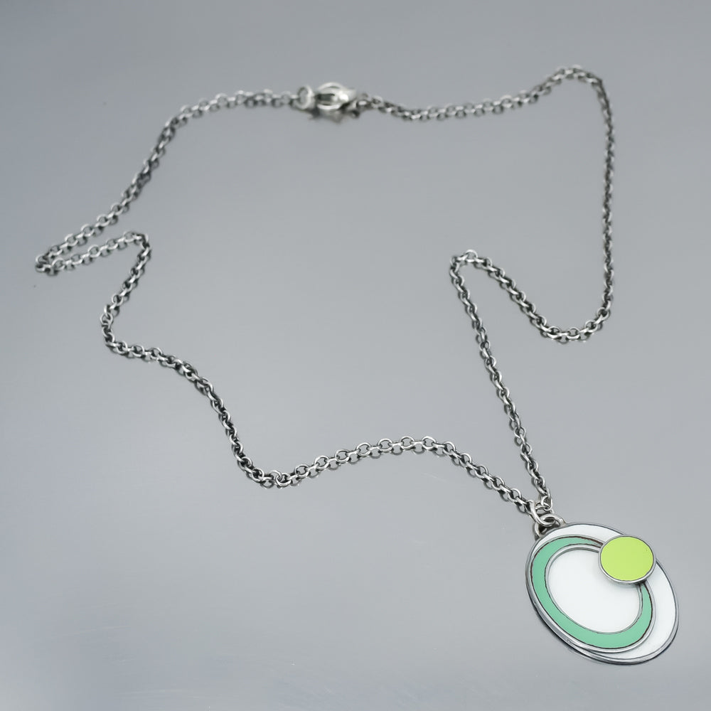 turquoise, green, white, handmade pendant necklace on an oxidized sterling silver chain using vintage car parts with the original car paint intact. Joyride Jewelry. Jewelry made from vintage car parts. 
Fun, unique, original, colorful
sustainable, recycled 