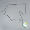 turquoise, green, white, handmade pendant necklace on an oxidized sterling silver chain using vintage car parts with the original car paint intact. Joyride Jewelry. Jewelry made from vintage car parts. 
Fun, unique, original, colorful
sustainable, recycled 