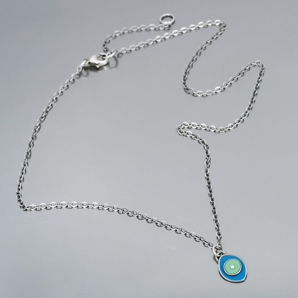 blue and turquoise tiny pendant, great necklace for layering, handmade using vintage car parts with the original car paint intact. Joyride Jewelry. Jewelry made from vintage car parts. 
Fun, unique, original, colorful
sustainable, recycled. oxidized sterling silver chain
