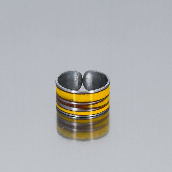 yellow band style ring, sightly adjustable, handmade using vintage car parts with the original car paint intact. Joyride Jewelry. Jewelry made from vintage car parts. 
Fun, unique, original, colorful
sustainable, recycled 