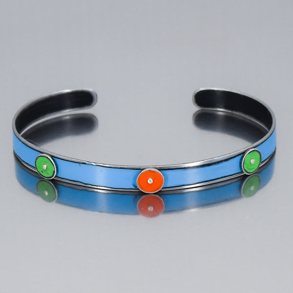 blue bracelet with green and orange circles or dots. handmade using vintage car parts with the original car paint intact. Joyride Jewelry. Jewelry made from vintage car parts. 
Fun, unique, original, colorful
sustainable, recycled 