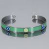 turquoise bracelet with blue and green circles or dots. handmade using vintage car parts with the original car paint intact. Joyride Jewelry. Jewelry made from vintage car parts. 
Fun, unique, original, colorful
sustainable, recycled 