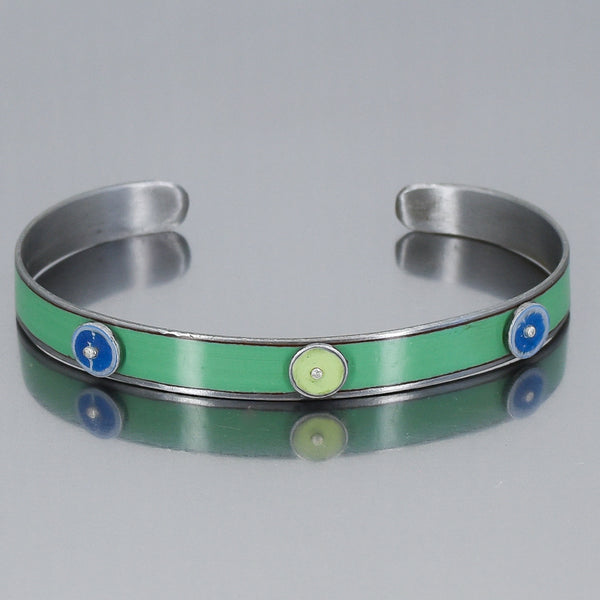 turquoise bracelet with blue and green circles or dots. handmade using vintage car parts with the original car paint intact. Joyride Jewelry. Jewelry made from vintage car parts. 
Fun, unique, original, colorful
sustainable, recycled 