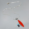 Sterling silver necklace with a pendant featuring red, turquoise, and black elements inspired by classic 60s vehicles.
