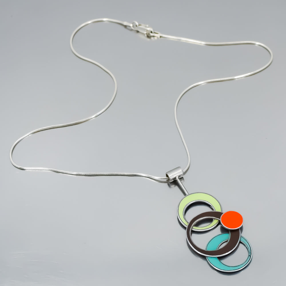Sterling silver necklace with pendant featuring original car paint from Plymouth, Oldsmobile, Ford, and Chevy models.