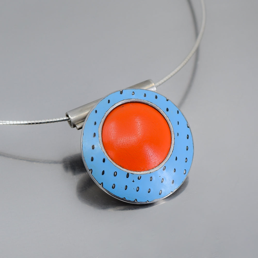 Round pendant necklace with blue and orange original car paint from 77 International Scout and 74 Ford F150 on silver cable