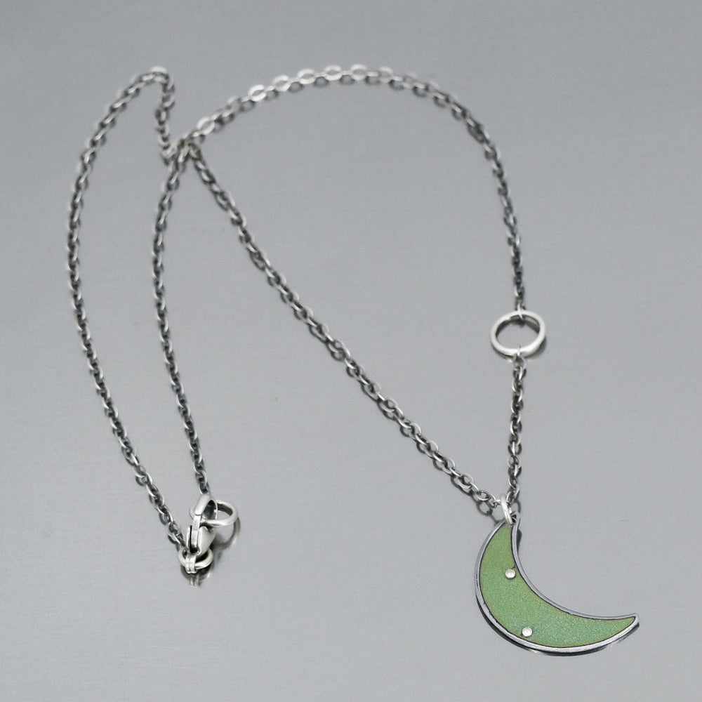 18-inch oxidized sterling silver chain necklace with a green crescent pendant made from 69 Chevy Nova car paint.