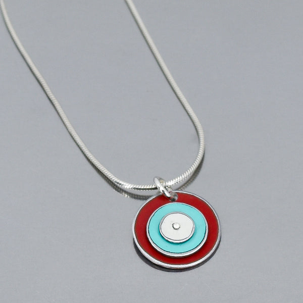 Round pendant necklace with red, turquoise, and white original car paint on sterling silver snake chain