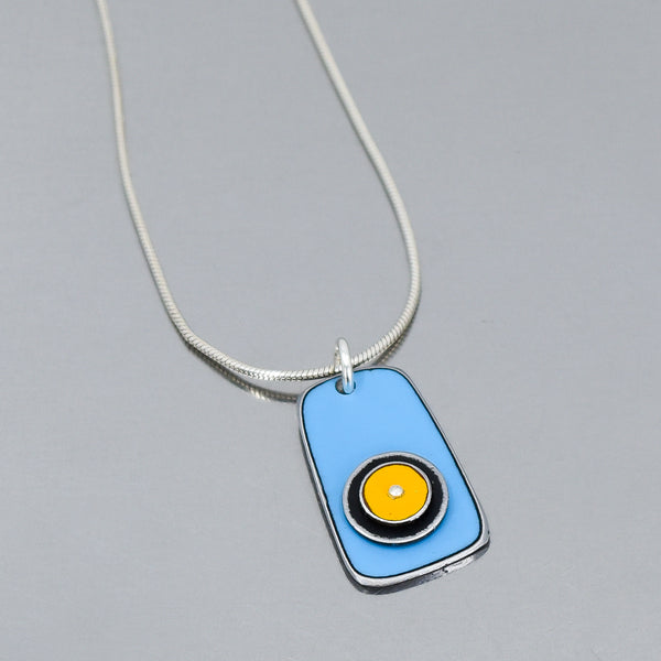 Silver snake chain necklace with blue and yellow enamel pendant inspired by vintage 70s Ford pickup paint finish