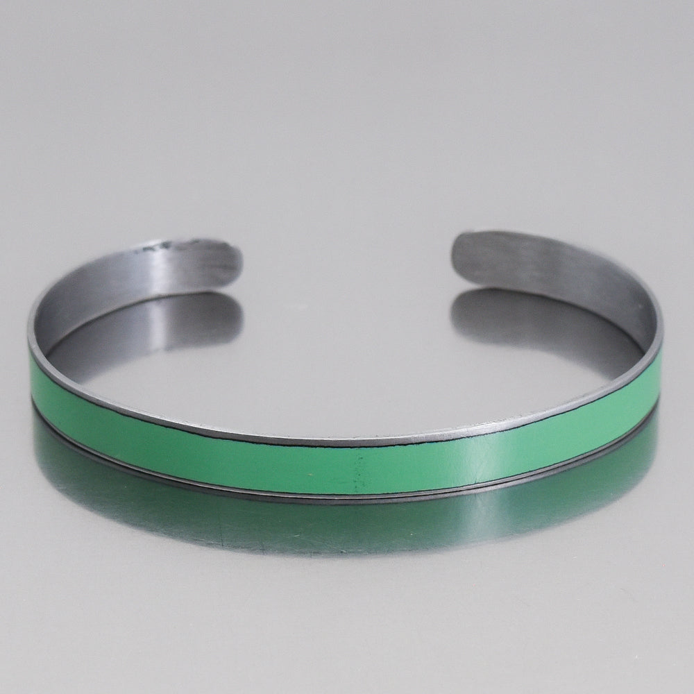 Silver cuff bracelet with a turquoise green enamel strip made from original Chevy Blazer vintage car paint