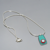 Marion - Chevy, Mercury, AMC necklace with light turquoise AMC Rambler pendant on sterling silver snake chain.