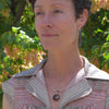 Mildred - Chevy & Plymouth pendant necklace worn by woman outdoors with green foliage background