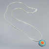 Clara - Ford & Plymouth necklace with original turquoise Ford Thunderbird paint on sterling silver chain. concentric circles in orange and sublime green made from vintage car parts by Joyride Jewelry