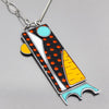 Introducing Gracie by Ford & Dodge—a geometric pendant necklace with rectangles, circles, dots, and abstract shapes in bold colors with a silver outline on an oxidized sterling silver chain. Enjoy free shipping!.
