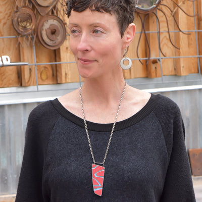 Addie - Ford necklace made from 74 Ford F150 paint worn by a woman with matching sterling silver earrings.