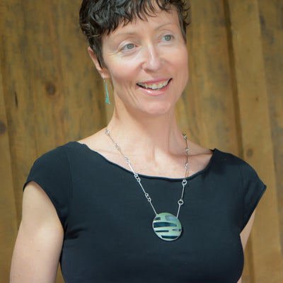 Ina - Chevy & Pontiac necklace with original 69 Chevy Nova green paint on oxidized sterling silver chain worn by woman