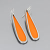The Willie - AMC Rambler earrings are made from vintage car parts  feature teardrop shapes with bright orange centers, silver outlines, and sterling silver ear wires, shown on a gray background.