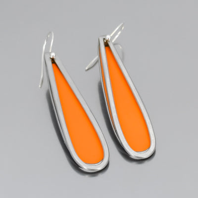 The Willie - AMC Rambler earrings are made from vintage car parts  feature teardrop shapes with bright orange centers, silver outlines, and sterling silver ear wires, shown on a gray background.