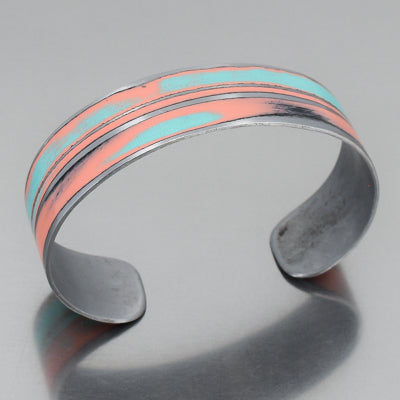 The Wilson - cuff bracelet made from a vintage 1956 Buick Special with the original car paint intact. turquoise and coral pink. sustainable, recycled. Handmade jewelry by Joyride Jewelry.