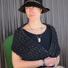 Louie - Chevy pickup bracelet worn on wrist with black hat and shawl, showcasing hand-etched 67 Chevy paint design.