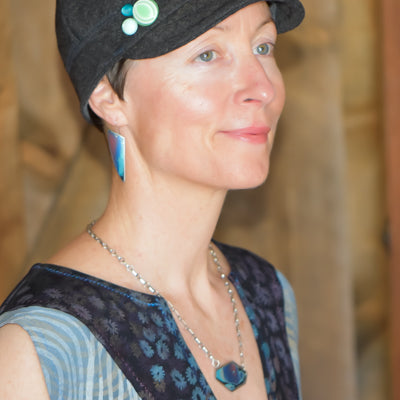 Woman wearing Jewels - Ford Supervan earrings and matching necklace with sterling silver ear wires and blue-green paint finish